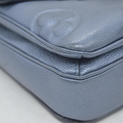 $3100 Louis Vuitton Metallic Empreinte Monogram Giant Pochette Metis Navy Nacre