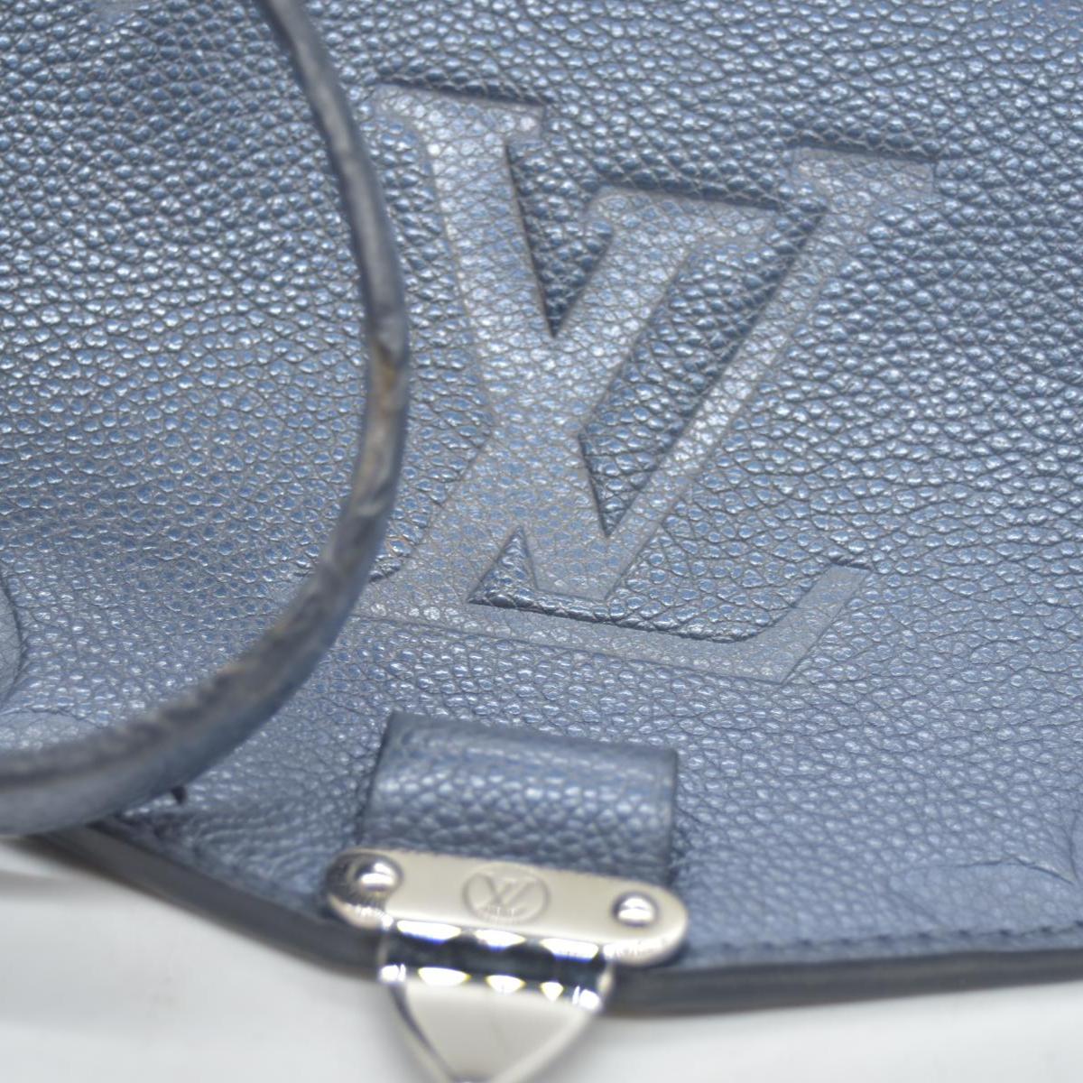 $3100 Louis Vuitton Metallic Empreinte Monogram Giant Pochette Metis Navy Nacre