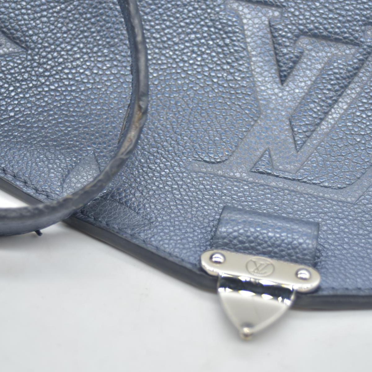$3100 Louis Vuitton Metallic Empreinte Monogram Giant Pochette Metis Navy Nacre