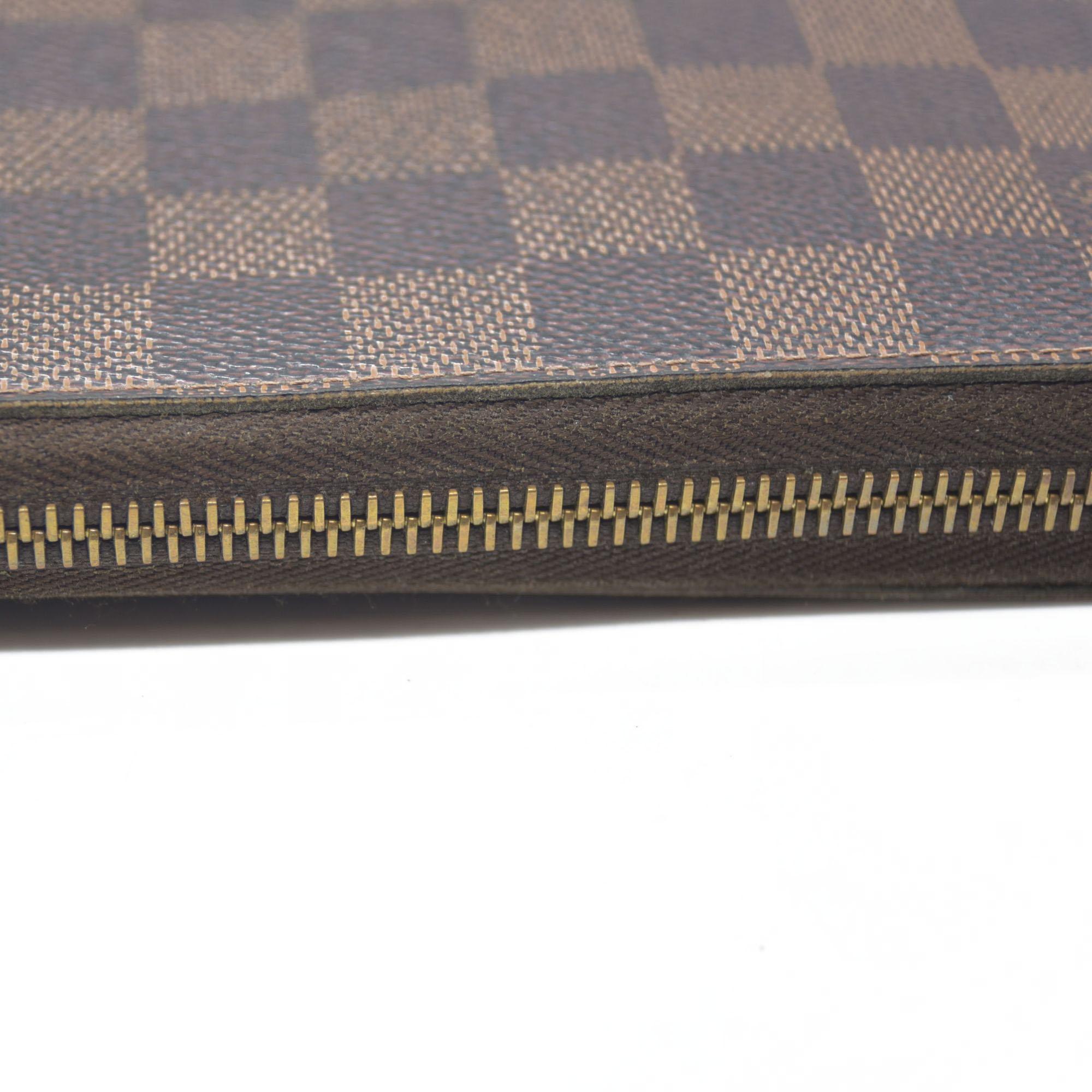 $915 Louis Vuitton Damier Ebene Zippy Wallet CA5009