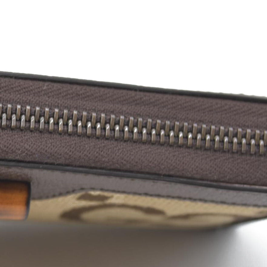 $850 CONSIGNMENT Gucci  Monogram Jumbo GG Textured Dollar Calfskin Diana Zip Around Continental Wallet Camel Ebony New Acero