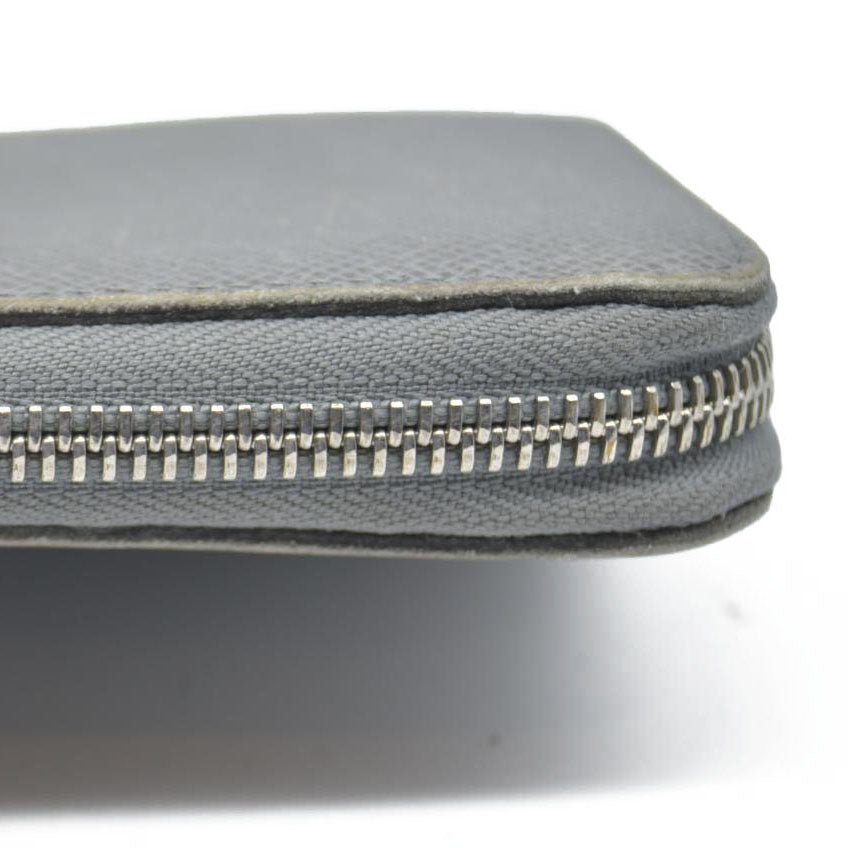 AUCTION $985 Louis Vuitton  Taiga Zippy Organizer Wallet Glacier