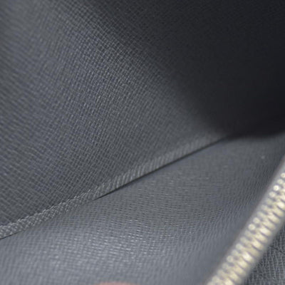 AUCTION $985 Louis Vuitton  Taiga Zippy Organizer Wallet Glacier