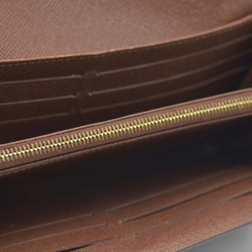 AUCTION $725 Louis Vuitton Monogram Sarah Wallet (no date code)