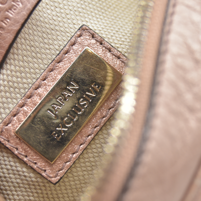 $1490 Gucci  Pebbled Calfskin Small Soho Disco Bag Camelia