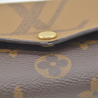 $885 RFID Louis Vuitton Reverse Monogram Giant Sarah Wallet