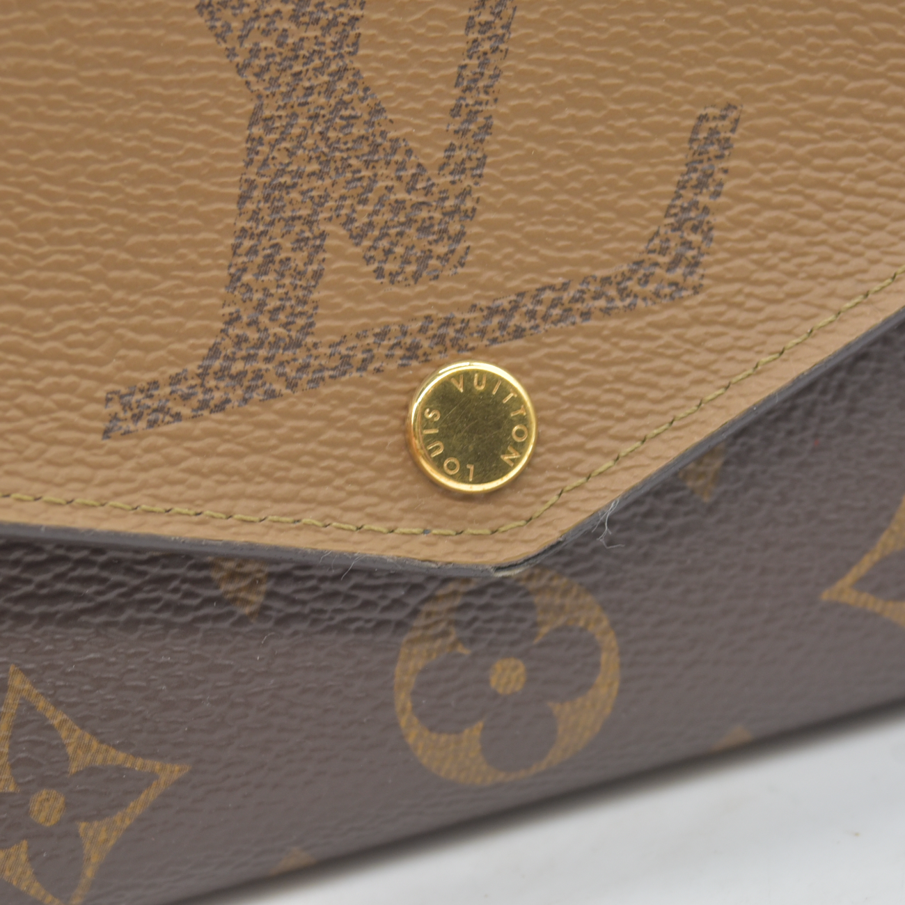 $885 RFID Louis Vuitton Reverse Monogram Giant Sarah Wallet