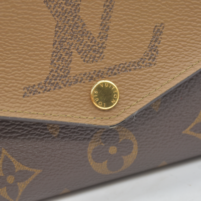 $885 RFID Louis Vuitton Reverse Monogram Giant Sarah Wallet