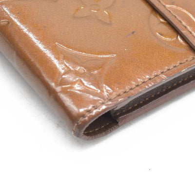 $840 LOUIS VUITTON Monogram Vernis Porte Tresor International Trifold Wallet