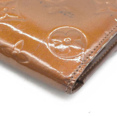 $840 LOUIS VUITTON Monogram Vernis Porte Tresor International Trifold Wallet