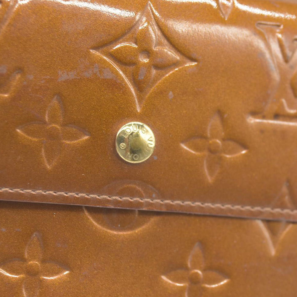 $840 LOUIS VUITTON Monogram Vernis Porte Tresor International Trifold Wallet