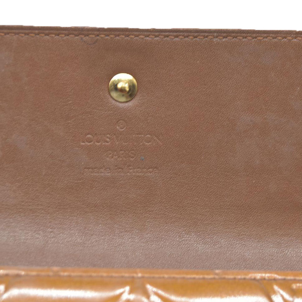 $840 LOUIS VUITTON Monogram Vernis Porte Tresor International Trifold Wallet