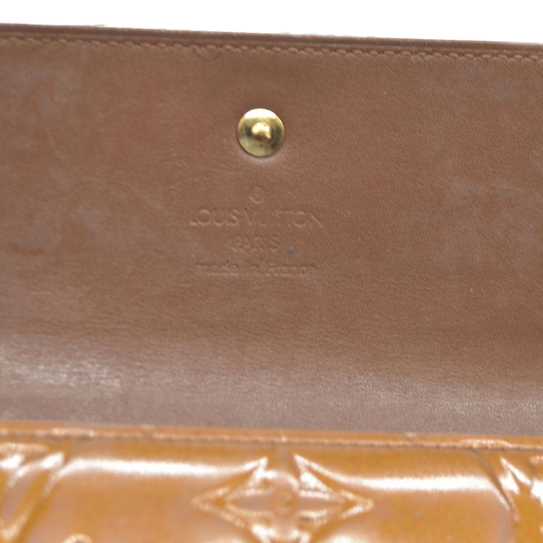 $840 LOUIS VUITTON Monogram Vernis Porte Tresor International Trifold Wallet