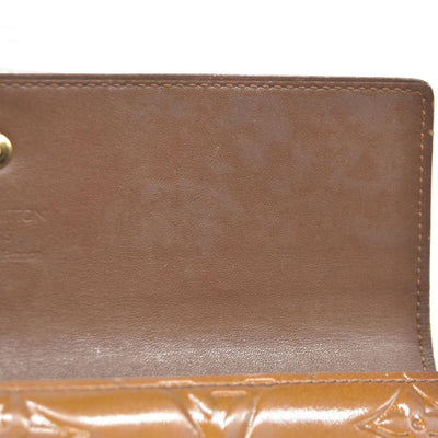 $840 LOUIS VUITTON Monogram Vernis Porte Tresor International Trifold Wallet