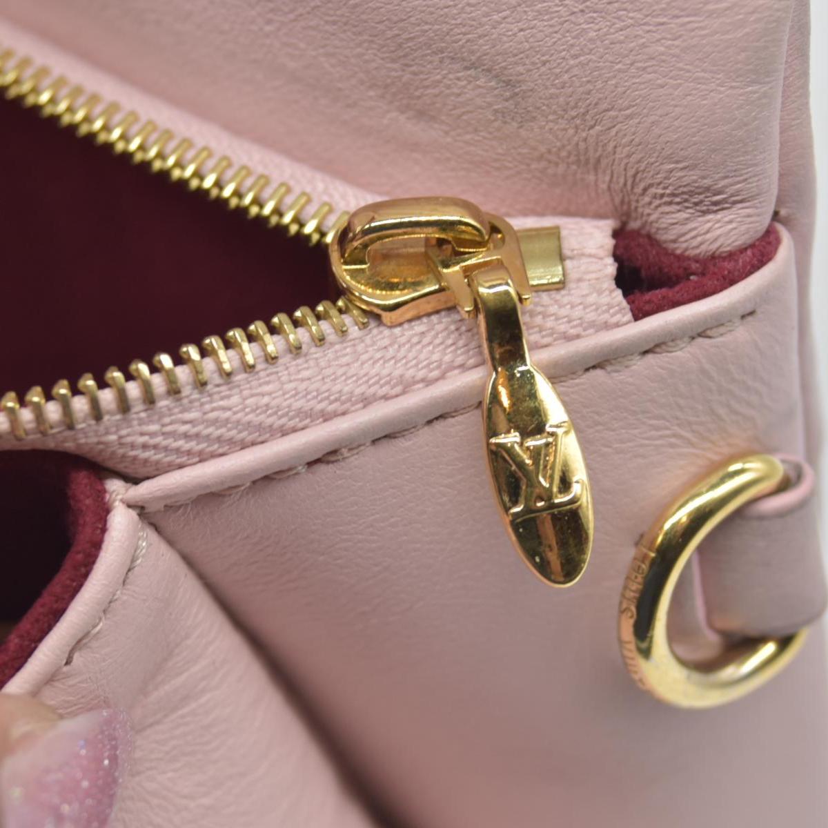 $2840 Louis Vuitton Monogram Embossed Pochette Coussin