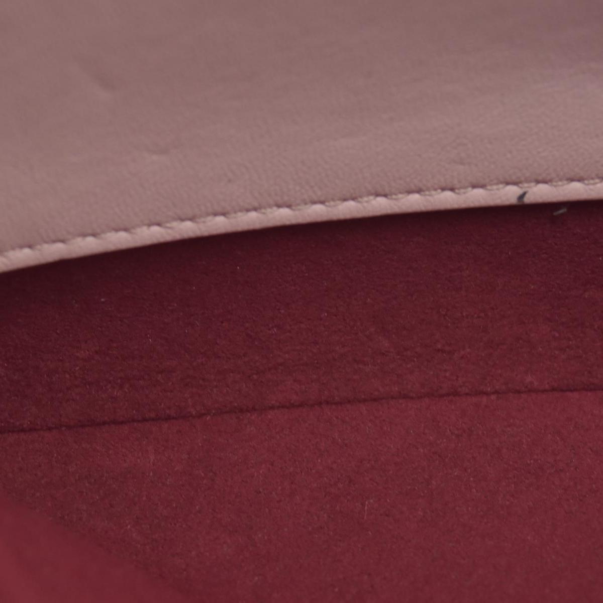 $2840 Louis Vuitton Monogram Embossed Pochette Coussin