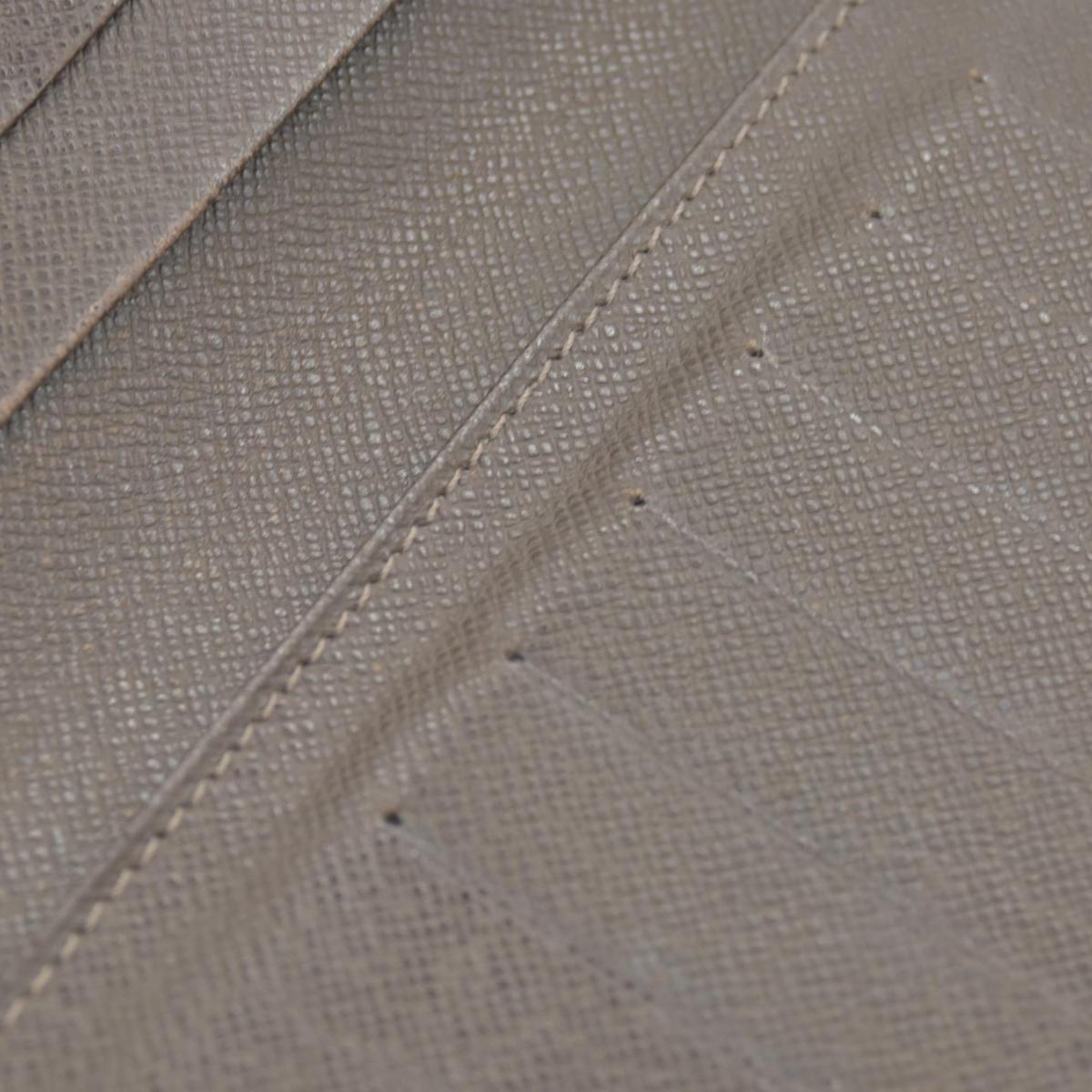 $835 Louis Vuitton Taiga Brown Leather Bifold Wallet CONSIGNMENT