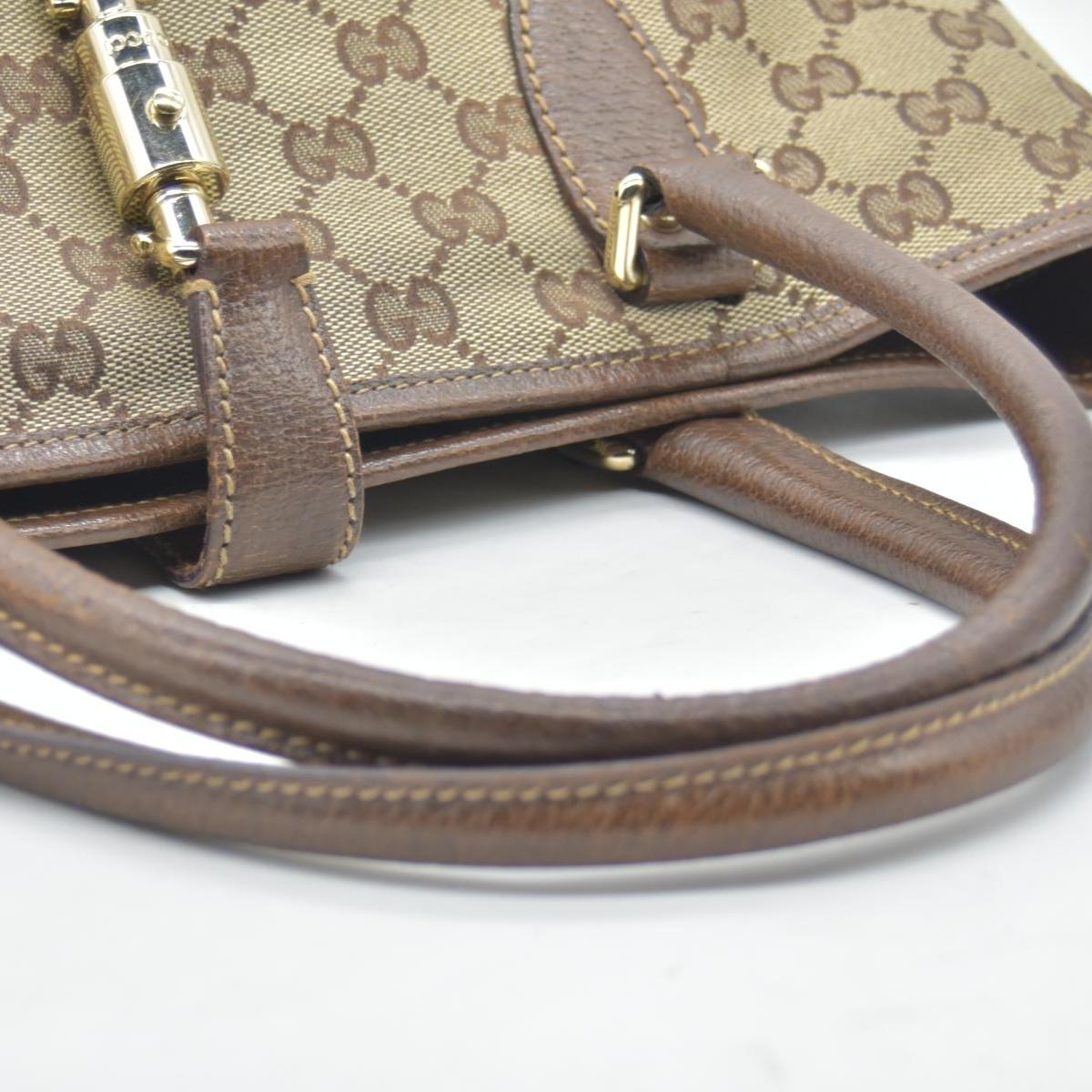 $1450 CONSIGNMENT Gucci GG Canvas Jackie Piston Lock Tote