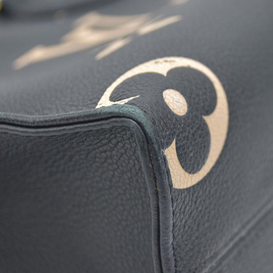 AUCTION $3550 Louis Vuitton Bicolor Monogram Empreinte Leather Onthego PM RFID