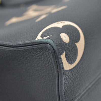 AUCTION $3550 Louis Vuitton Bicolor Monogram Empreinte Leather Onthego PM RFID