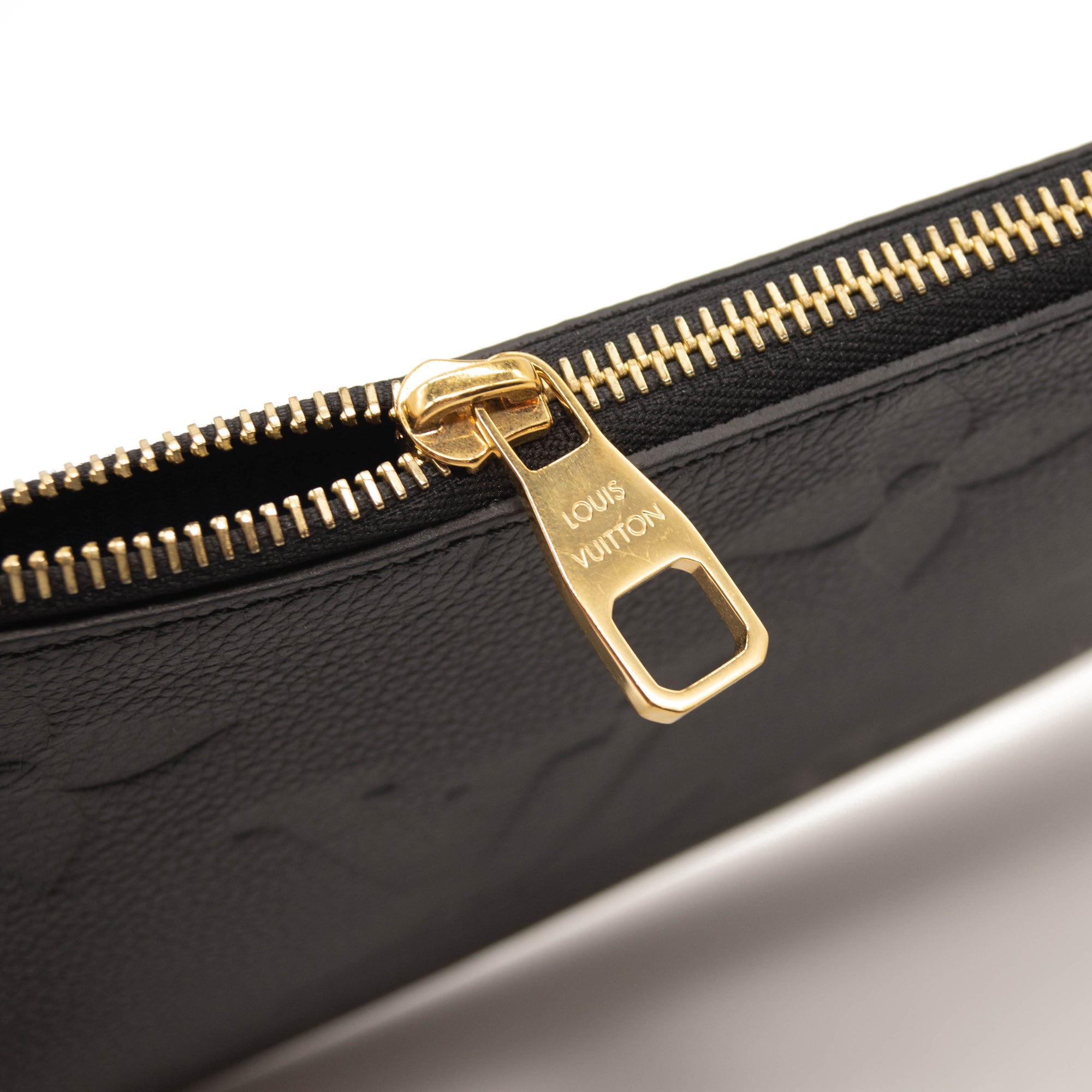 LOUIS VUITTON Empreinte Monogram Giant Neverfull MM Pochette Black Wristlet