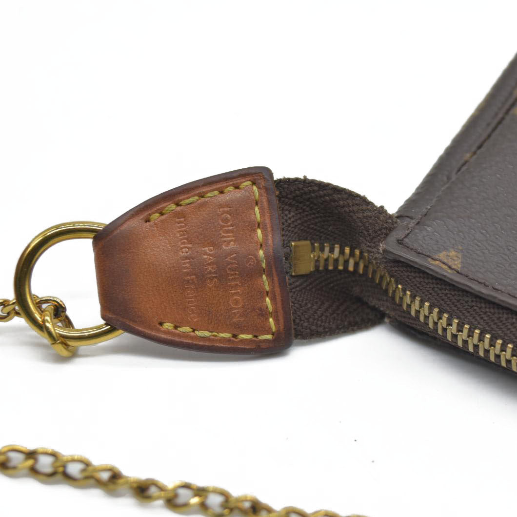 AUCTION  $1050 Louis Vuitton Monogram Mini Pochette Accessories SP2158