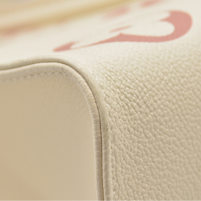 $3500 Louis Vuitton Rose Trianon/Creme Monogram Giant Empreinte Leather Onthego MM Bag