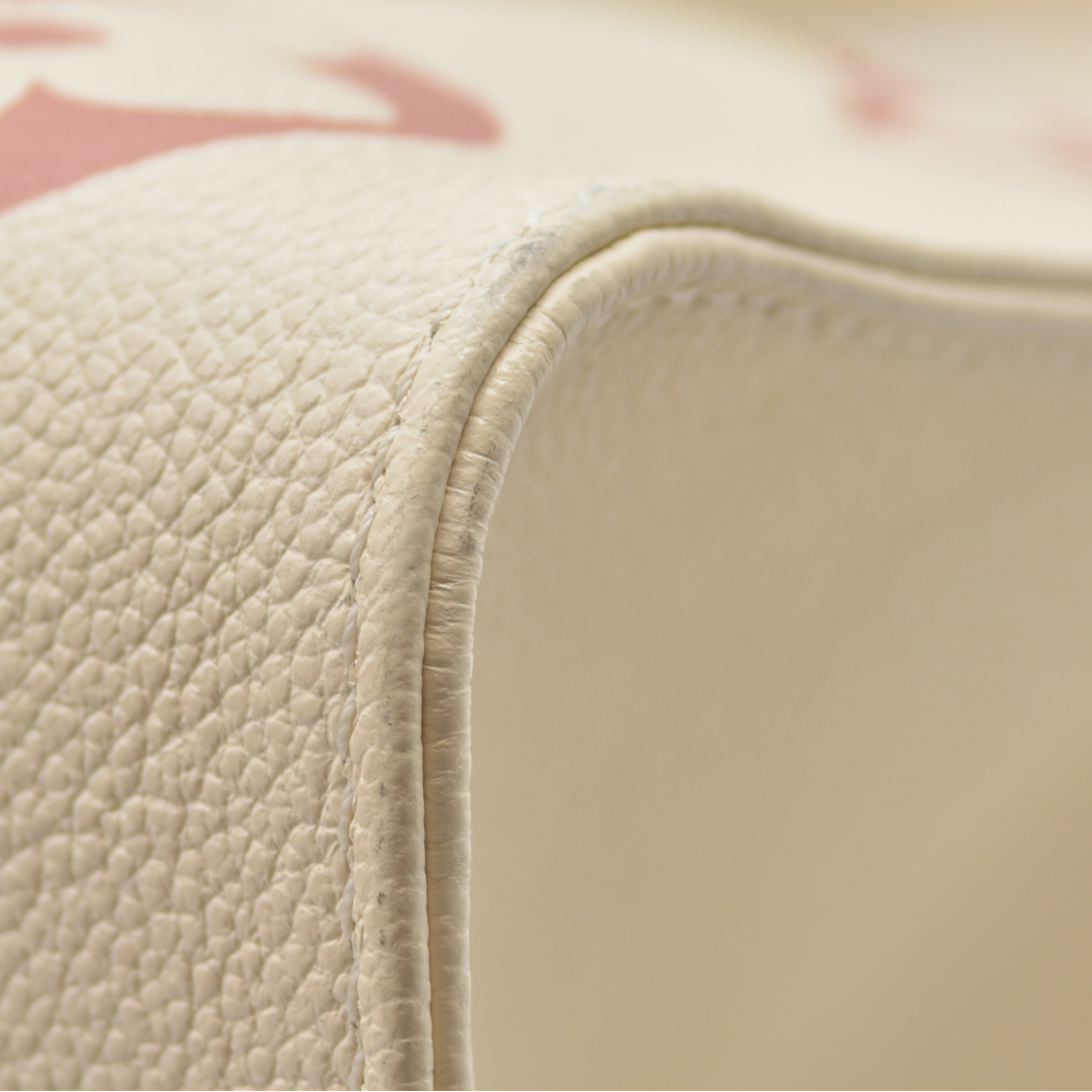 $3500 Louis Vuitton Rose Trianon/Creme Monogram Giant Empreinte Leather Onthego MM Bag