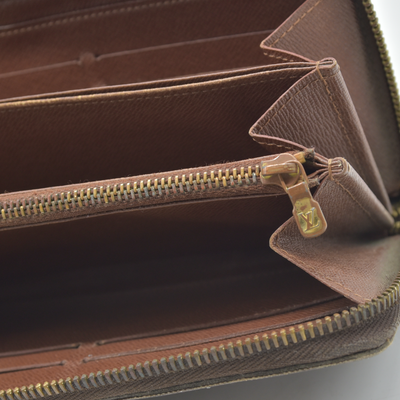 $915 2010 LOUIS VUITTON Monogram Zippy Wallet Brown CA2130