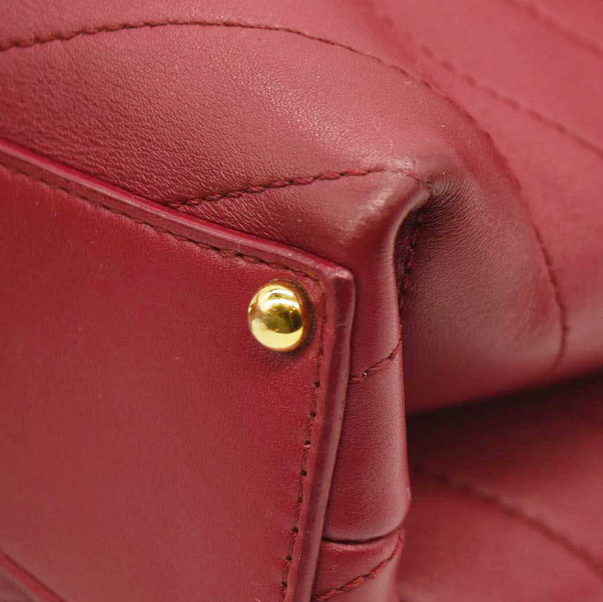 CHANEL  Calfskin Chevron Stitched Small Coco Flap Bag Red