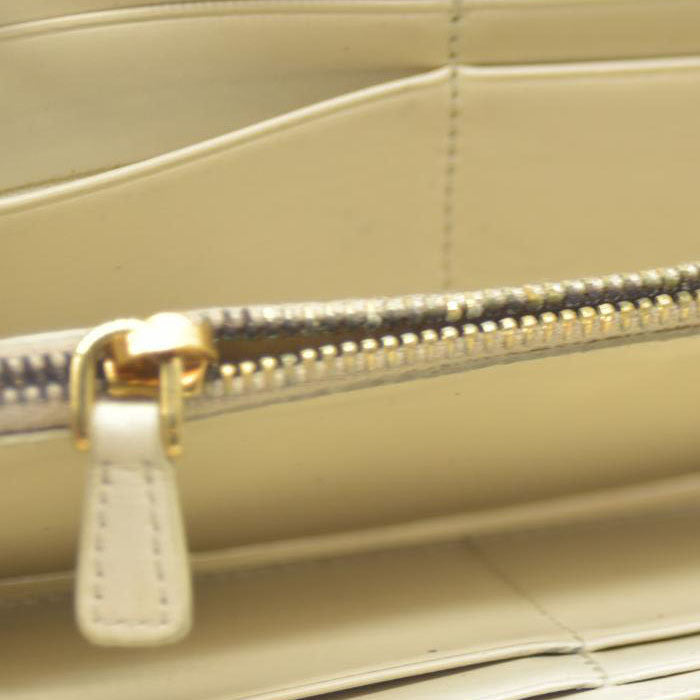 MIU MIU Logo Embossed Leather Zippy Long Wallet White