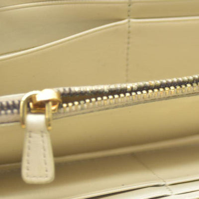 MIU MIU Logo Embossed Leather Zippy Long Wallet White