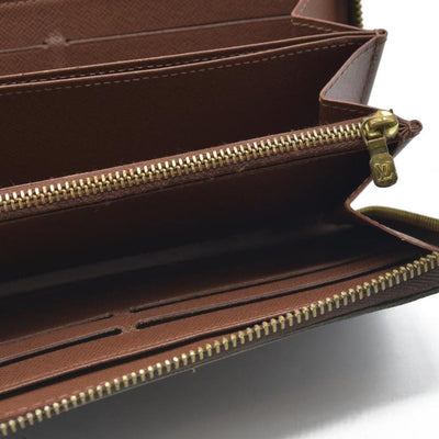 AUCTION $915 Louis Vuitton  Monogram Zippy Wallet CA5039