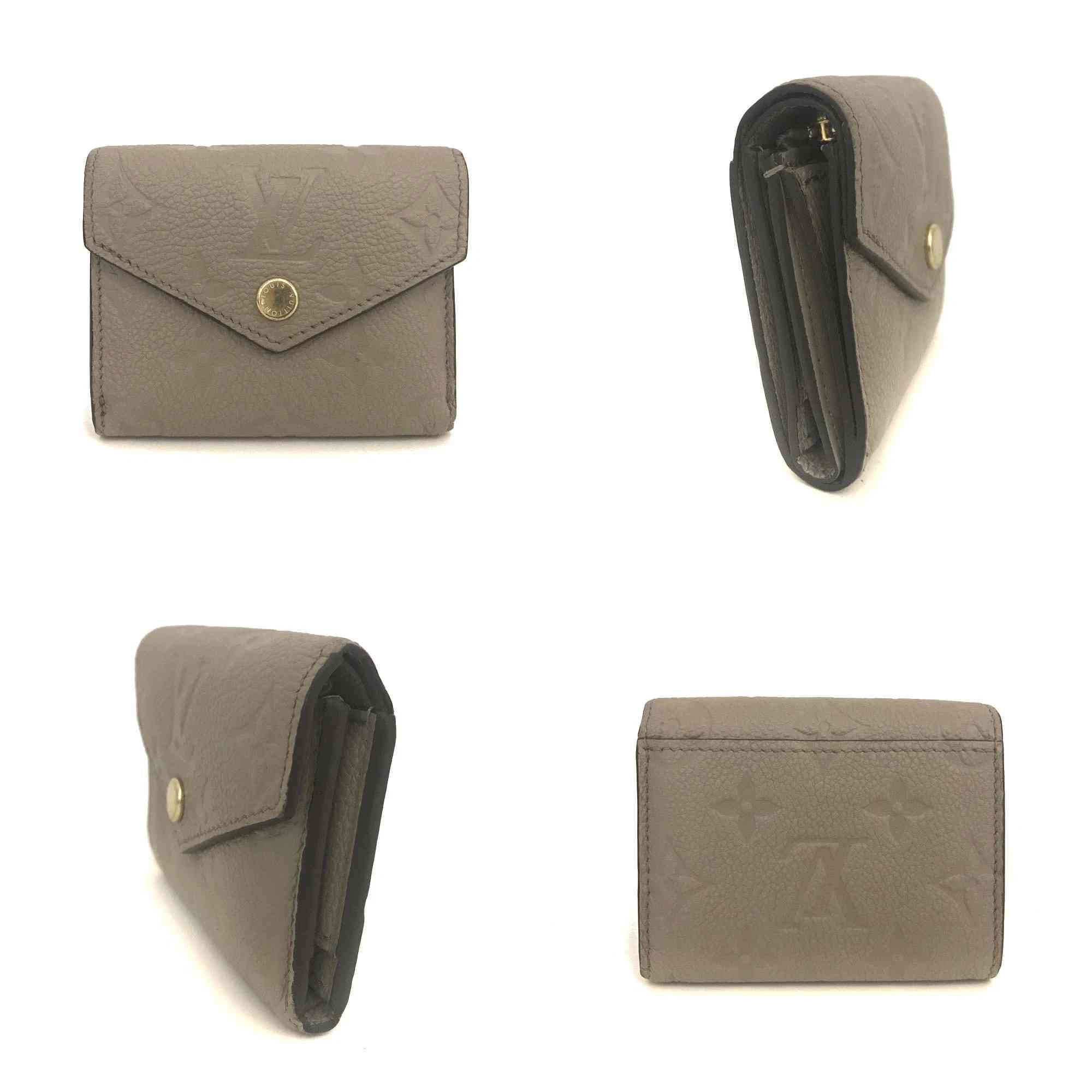 $795 Louis Vuitton Monogram Empreinte Portefeuille Zoe Mini Wallet