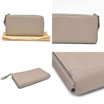 $1420 Louis Vuitton  Veau Cachemire Comete Wallet Galet MI5126