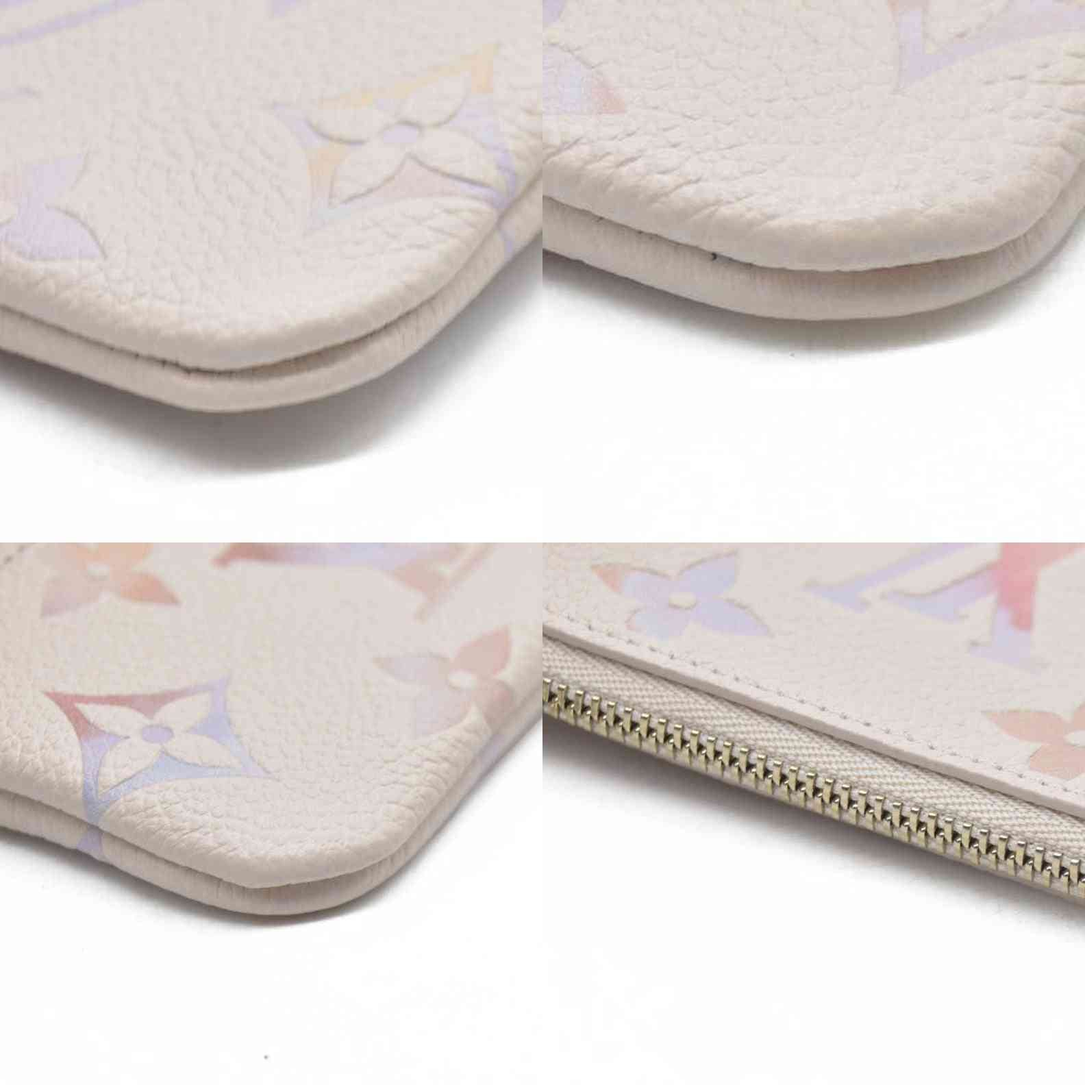 $625 Louis Vuitton  Empreinte Monogram Giant Key Pouch Dream Beige