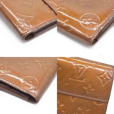 $840 LOUIS VUITTON Monogram Vernis Porte Tresor International Trifold Wallet