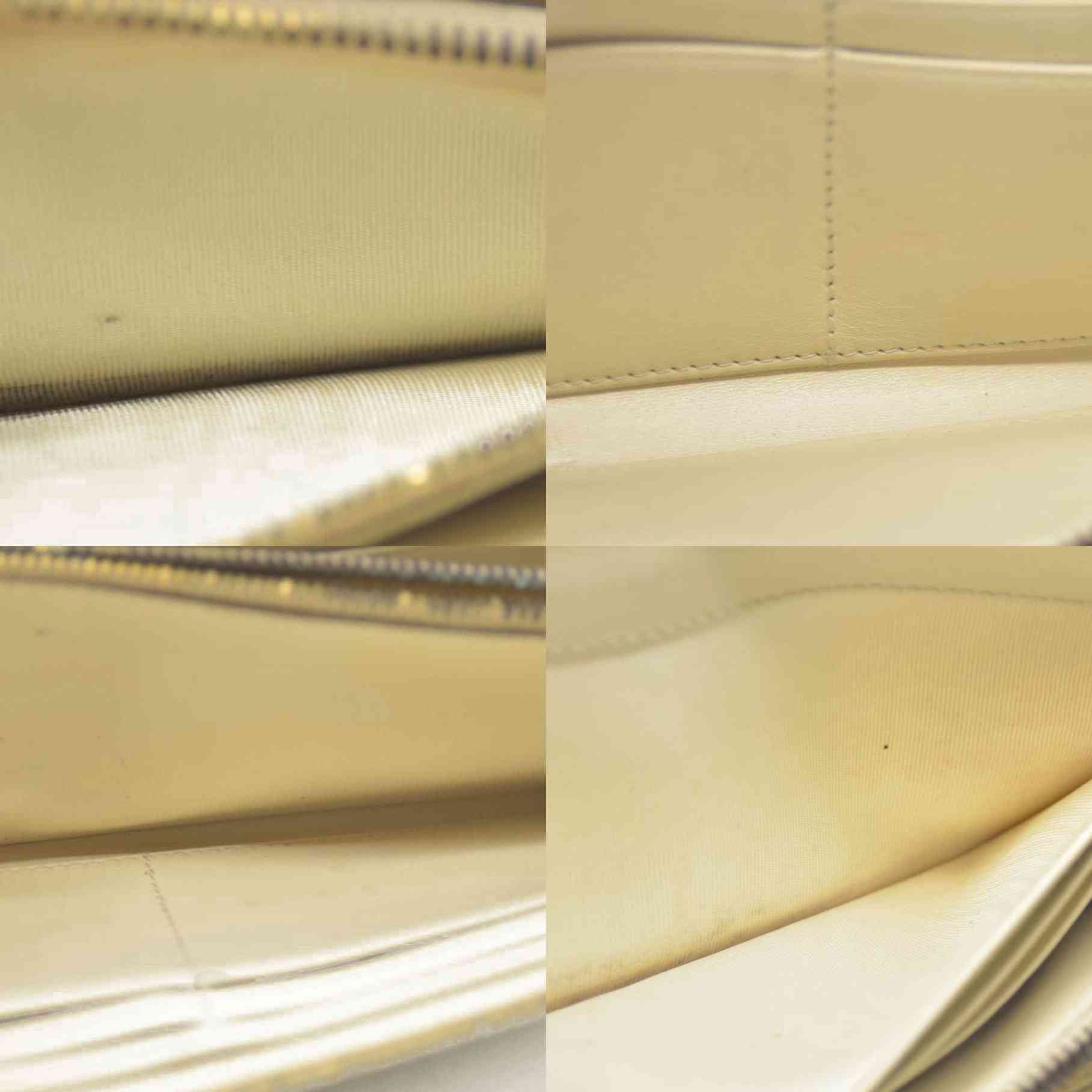 MIU MIU Logo Embossed Leather Zippy Long Wallet White