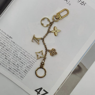 $675 Louis Vuitton Fleur de Monogram Bag Charm Chain Gold Beige