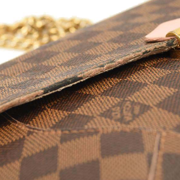 LOUIS VUITTON Damier Ebene Caissa Clutch in Rose Ballerine