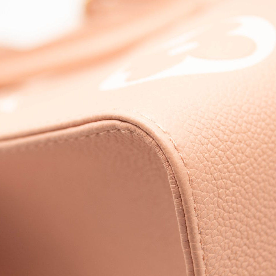 LOUIS VUITTON Empreinte Monogram Giant Onthego MM Arizona Creme