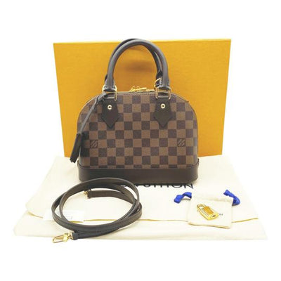 Alma bb leather handbag Louis Vuitton Brown in Leather - 30987108
